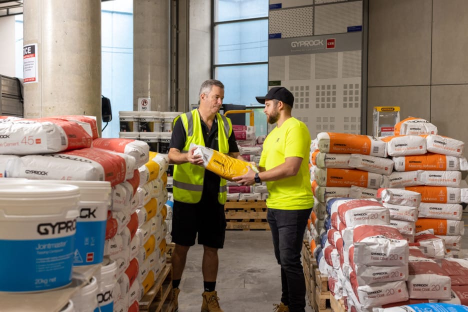 Trades people look at compound products in a Gyprock trade Centre