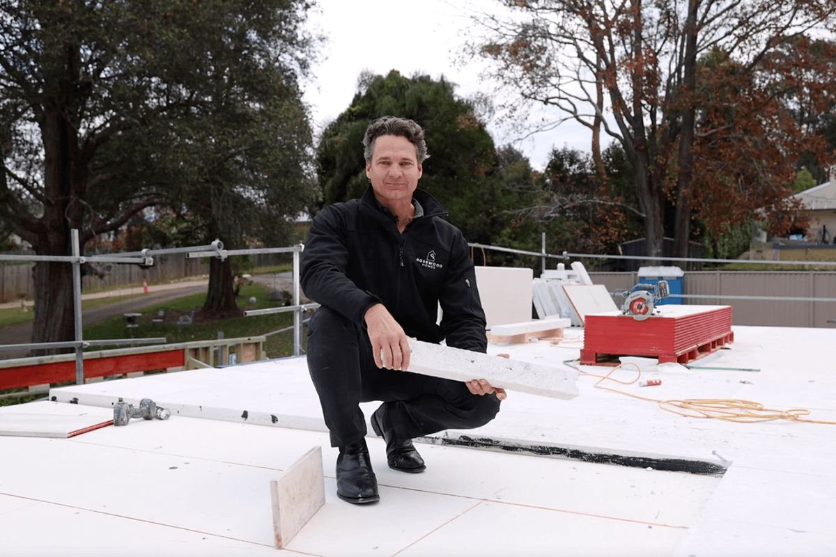 Adam holding a piece of Hebl PowerFloor