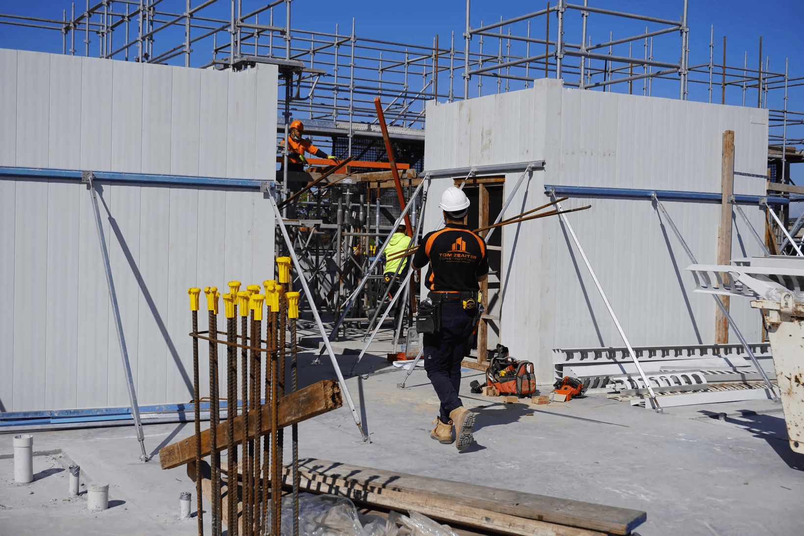 TZ Construction team member installing AFS Rediwall panels