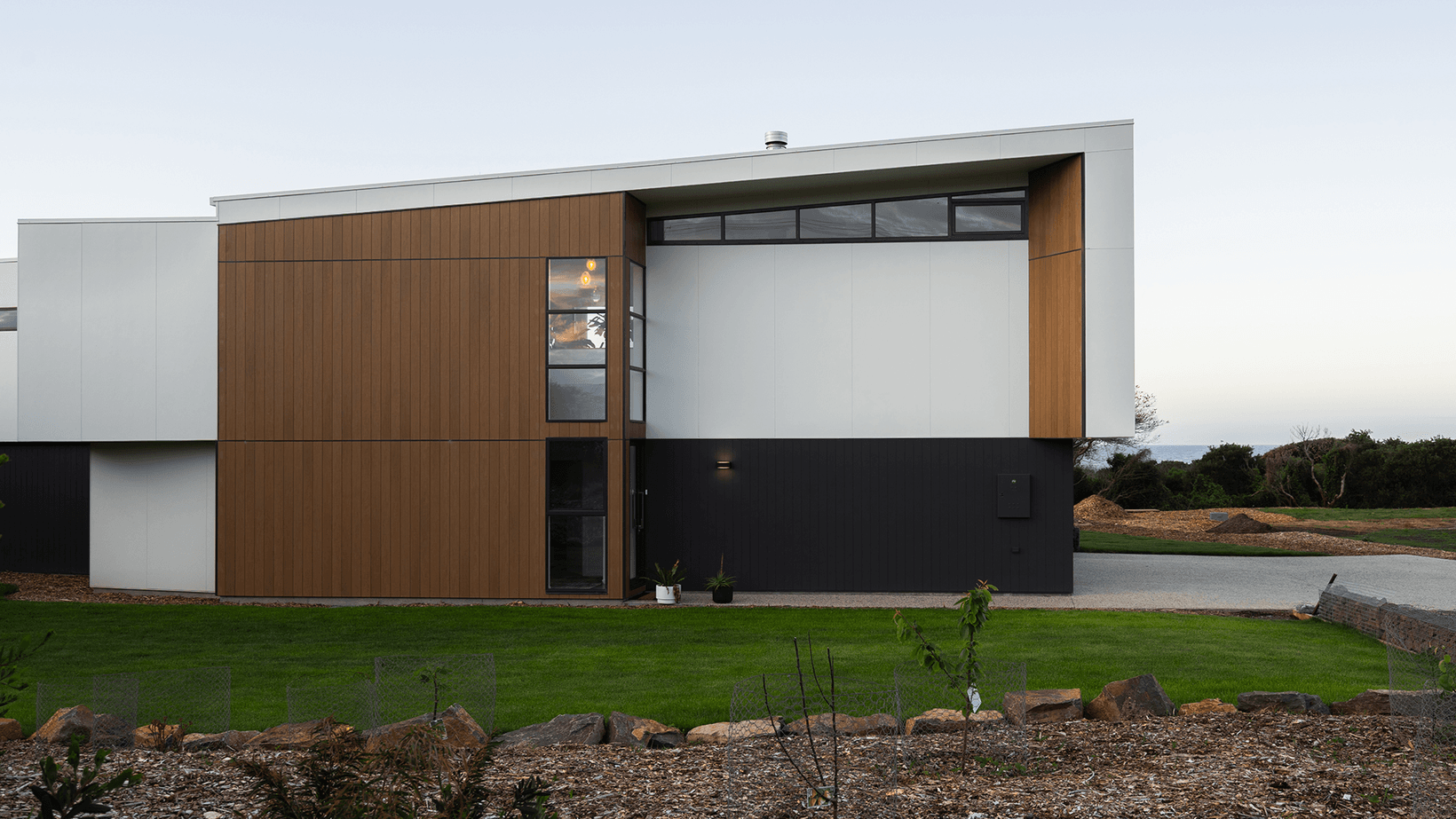 Territory Woodlands Teak paired with paint-on-site cladding, by S. Group.