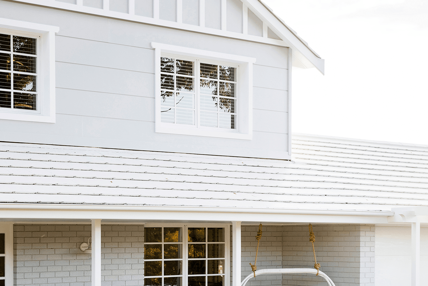 Three Birds Hamptons Makeover front facade roofing